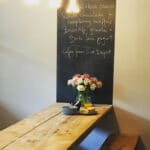 Chalk board at the end of the table